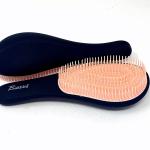 Entwirrende, entwirrende Haarbürste, Farbe Schwarz mit pfirsichfarbener Innenseite